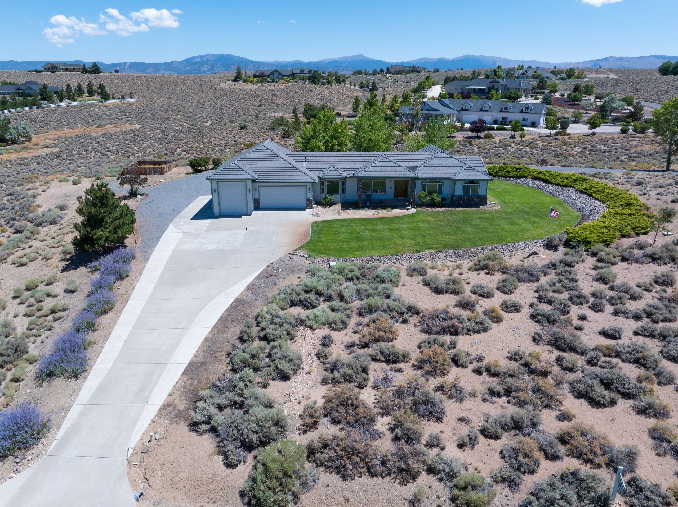 Higher aerial showing a residence, its parcel, and neighboring homes, Gardnerville, Nevada